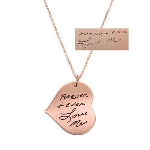 Hung from side, handwriting heart necklace in rose gold engraved with husband's signature & message. Shown with original handwritten note used to personalize it