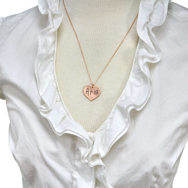 Custom rose gold handwriting heart necklace, shown on a model
