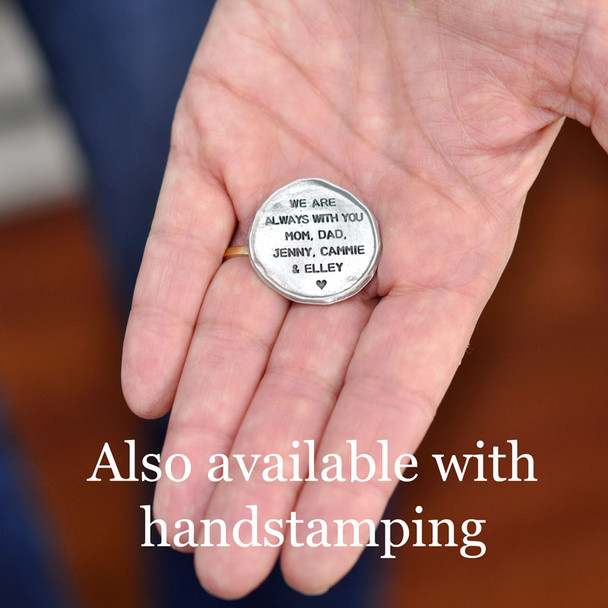 My Mantra Pocket Token in fine pewter, shown on in a hand, with handstamping