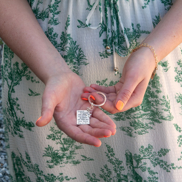 Friends are like stars sterling silver stamped custom key ring, shown in hands