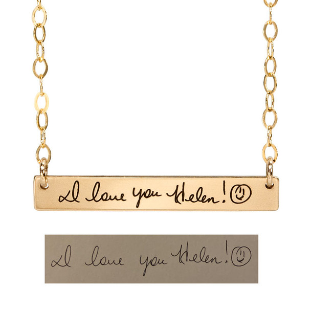 Gold bar necklace with handwritten note from sister, shown with the original handwriting used to personalize it