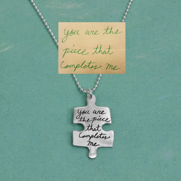 Child's handwriting puzzle necklace in silver, shown with original handwritten note