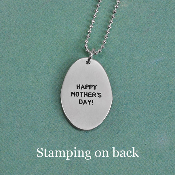 Mother's Day message stamped on back of silver charm