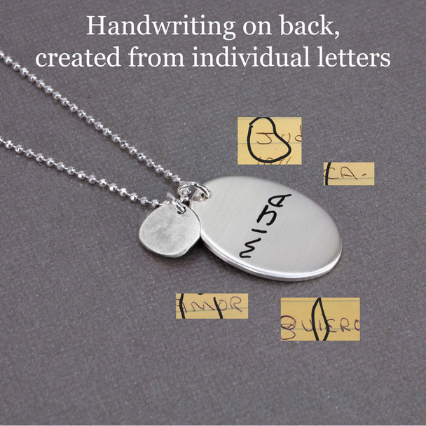 Handwriting on the back of handmade sterling silver oval custom engraved with letters taken from husband's handwritten note. Paired with silver disc with silver raised heart, hung on a silver ball chain