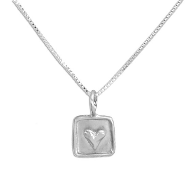 Personalized silver heart necklace with a raised heart on a silver square frame, shown close up on white background