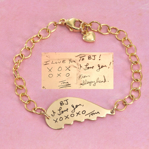 Gold memorial handwriting angel wing bracelet, personalized with your loved ones actual handwriting, showing the original handwritten note