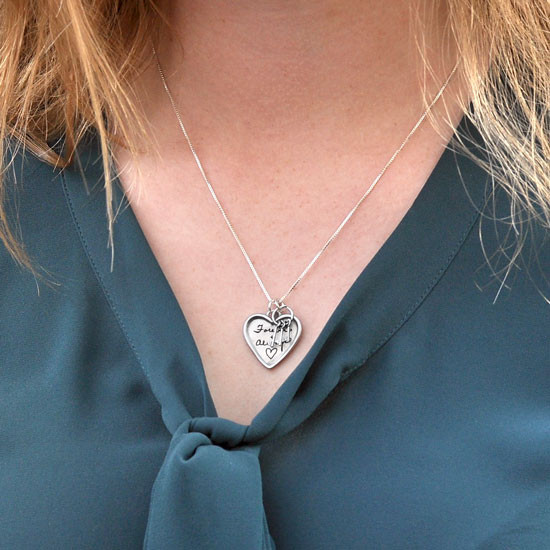 Large silver heart handwriting necklace with keys to your heart, shown on a model