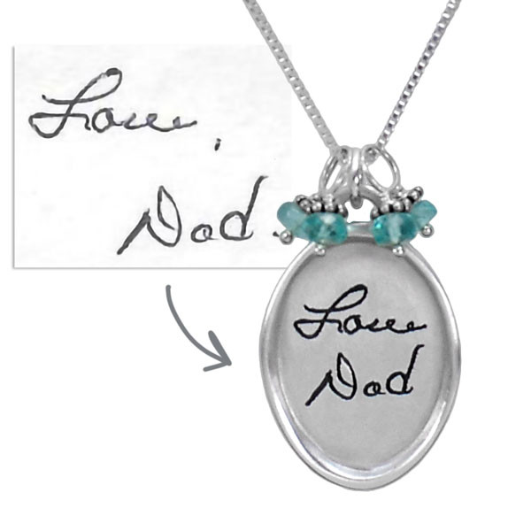 Silver Large oval handwriting memorial necklace, engraved with Dad's actual handwritten signature, with blue green birthstones, shown with the original handwriting used to personalize the necklace, on a white background