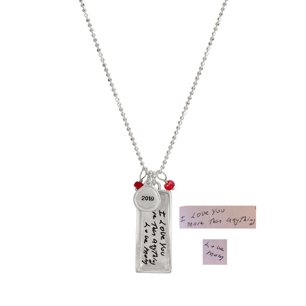 Custom rectangle family necklace in silver, personalized with handwritten notes from mom, with silver date charm and birthstones, shown on white