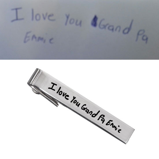 Personalized silver tie clip for grandpa with handwriting. shown with grandson's original handwriting