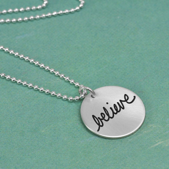 Side view of sterling silver Cure for PANDAS necklace, with the message "believe"
