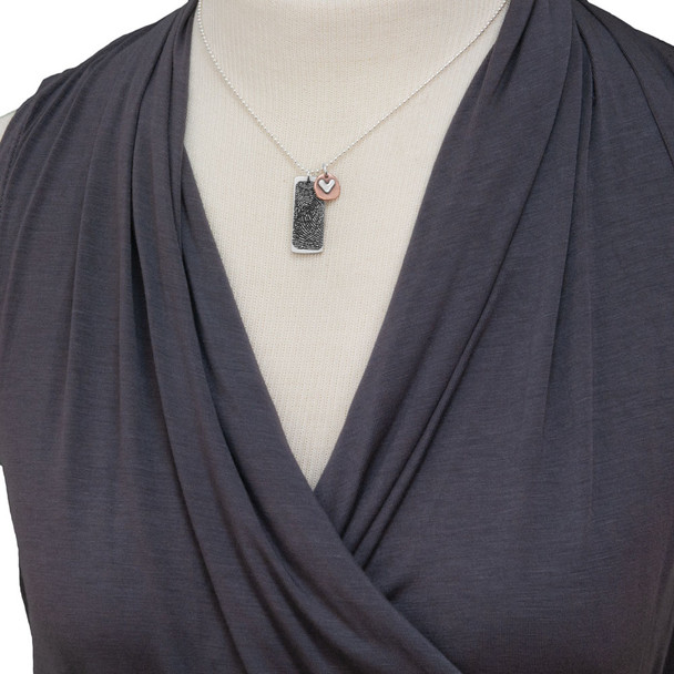 Model with custom Silver fingerprint necklace, personalized with your loved one's fingerprint, shown with copper circle