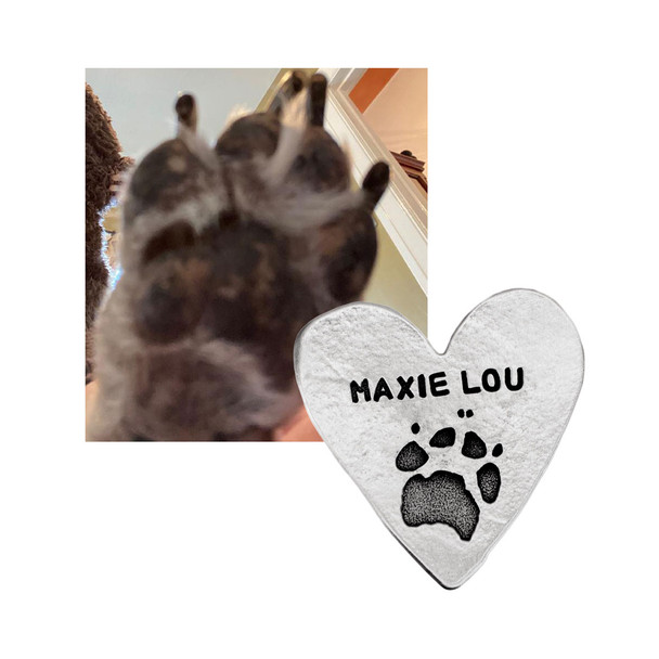 Your pet's paw print etched into a heart pocket token