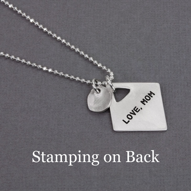 Optional stamping on back of personalized diamond shaped silver charm, with silver heart charm