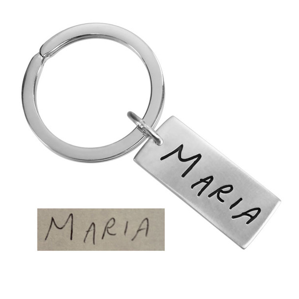 Custom Silver key ring shown with actual handwriting from mom used to personalize it, on white background