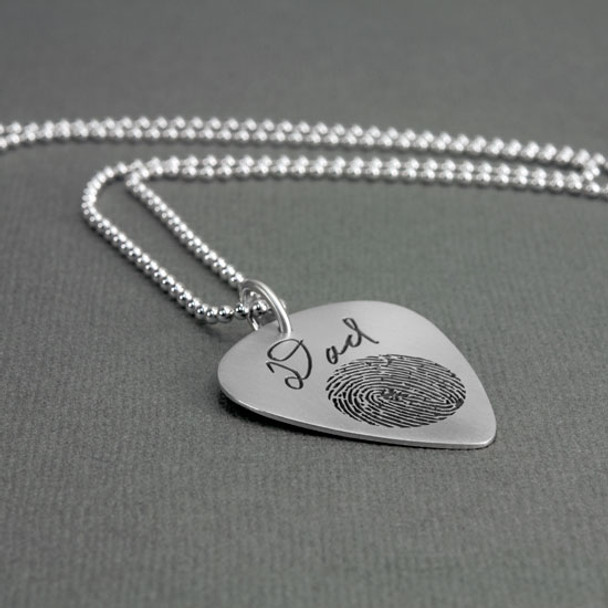 Custom actual fingerprint on guitar pick necklace sterling silver, shown from the side