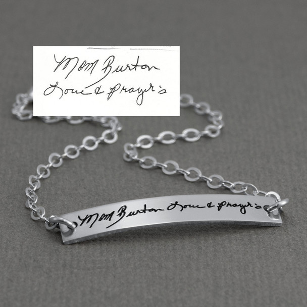 Dainty bracelet with your actual writing in sterling silver, shown from the side close up, with the original handwriting