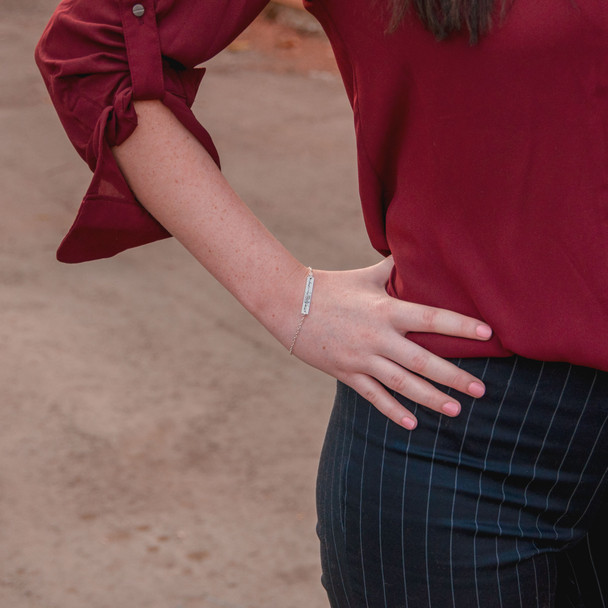 Dainty bracelet with your actual writing in sterling silver, shown on a model