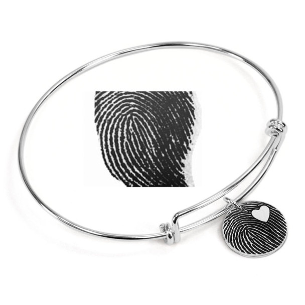 Expandable sterling silver bracelet with custom fingerprint pendant, shown with original fingerprint used to personalize it