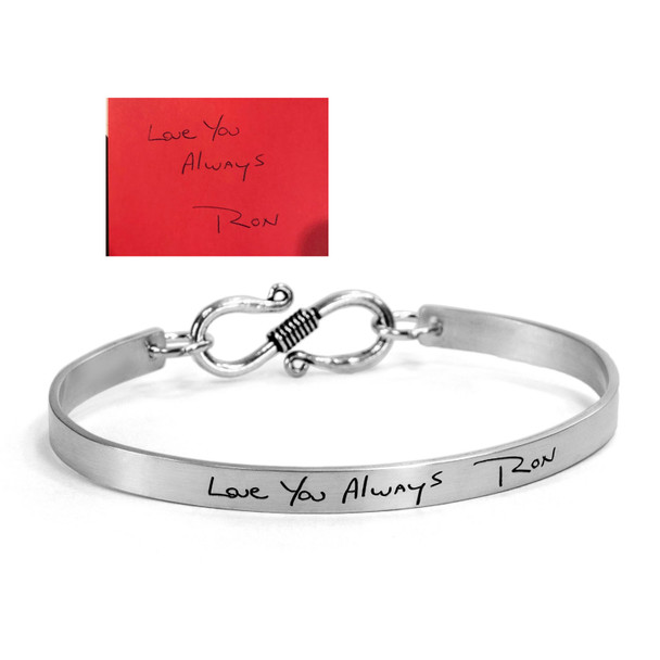 Sterling silver handwriting cuff bracelet with clasp, shown with the handwriting used to create it