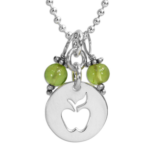 Apple & Peridot Necklace with silver apple teacher gift, close up on white