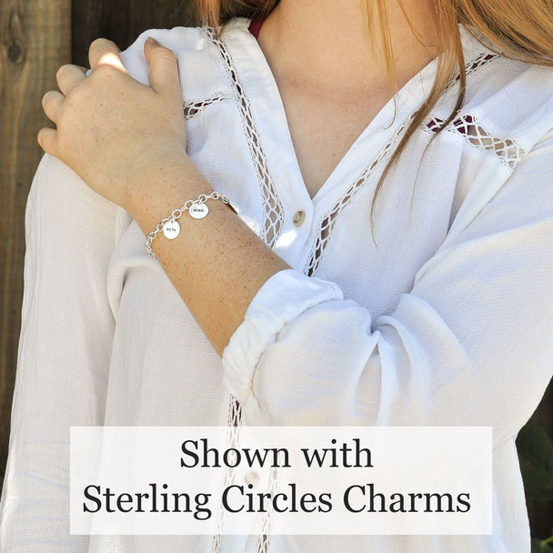 Sterling Silver Charm Bracelet Chain, with puffed silver heart, shown on model with silver circle charms stamped with kids' names