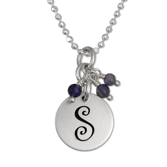 Curly initial handstamped onto pendant