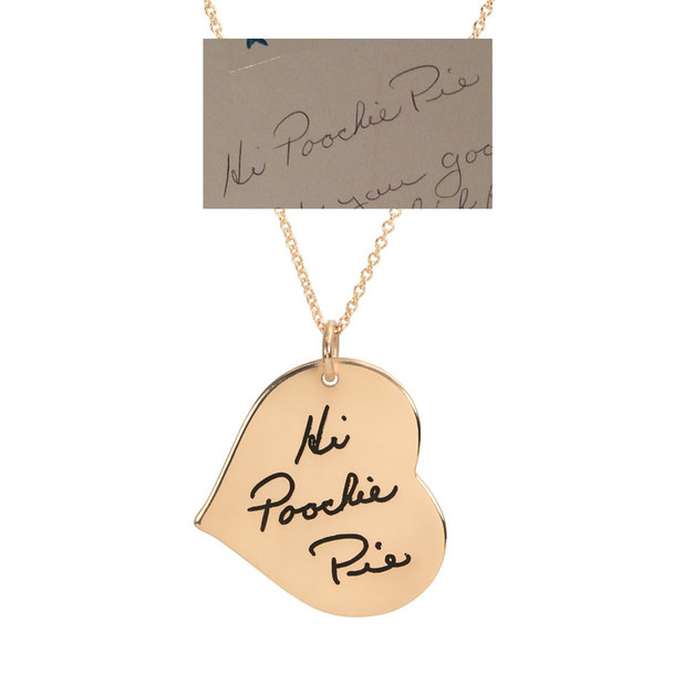 Custom Gold heart necklace with actual handwriting  showing chain on white background, with original handwritten note used to personalize it