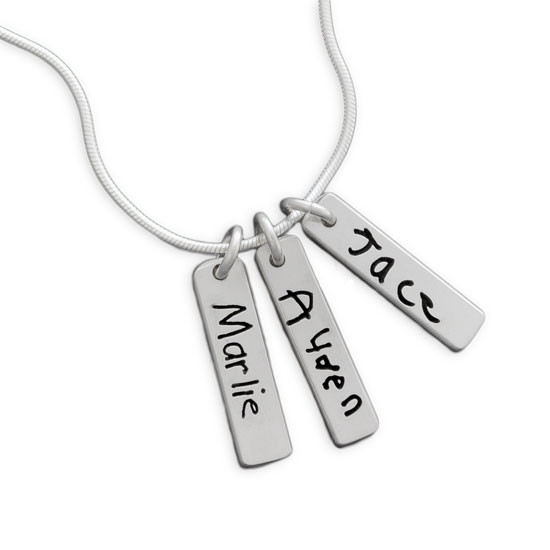 Signature necklace in sterling silver, with three children's actual handwriting, shown close up on white background