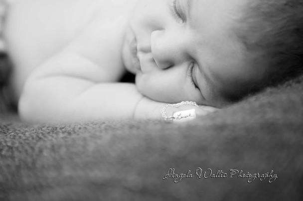 Baby Elizabeth wearing her grandmother's handwriting