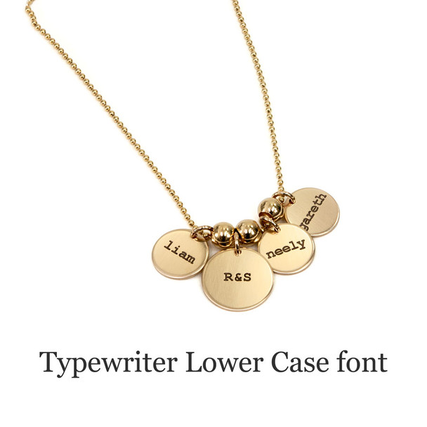 Hand stamped custom Gold Name Discs necklace personalized with kids' names on 4 discs, with gold spacer beads, stamped in Typewriter Lower Case font
