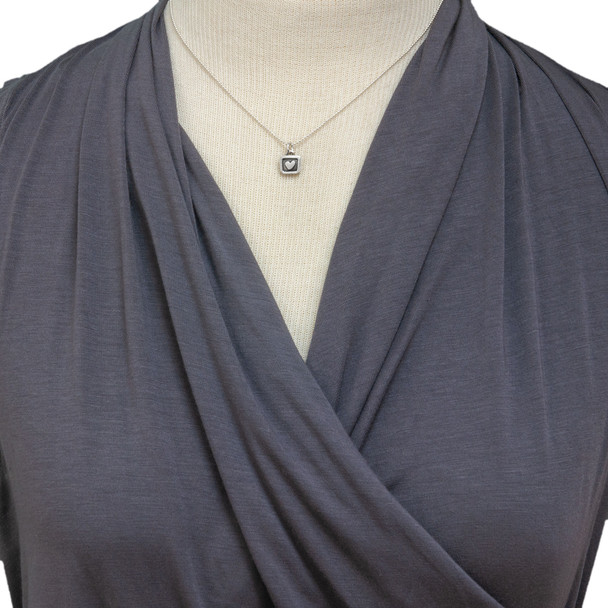 Silver Heart in a Square Charm, shown on a silver chain on a model