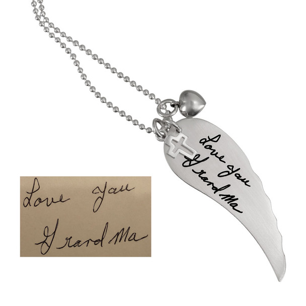 Large Handwriting Memorial Charm Angel Wing in silver, with a silver puffed heart, and Sterling Silver Cross with Cut-Out, shown close up on white, with the original handwriting used to create it