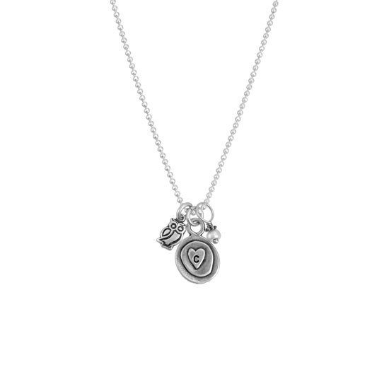 Silver charm initial necklace, with a heart, pearl and owl charm shown on white