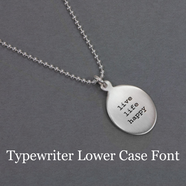 Custom sterling silver oval charm necklace, personalized with stamped inspirational phrase using Typewriter Lower Case font