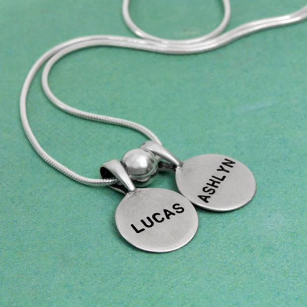 Personalized Sterling Circles of Affection, custom hand stamped silver charms with kids names, with a silver spacer bead, shown from the side