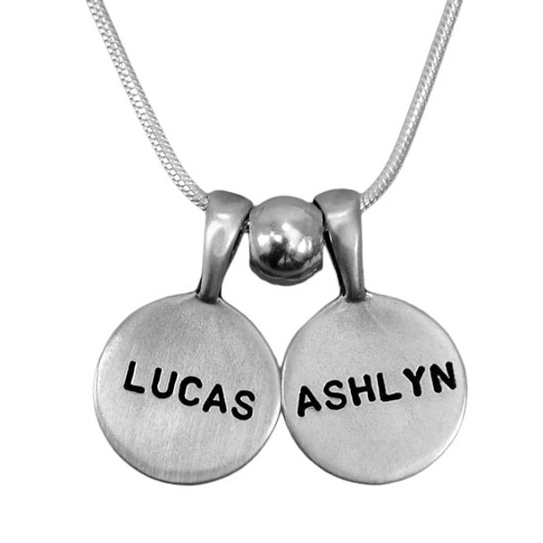 Personalized Sterling Circles of Affection, custom hand stamped silver charms with kids names, with a silver spacer bead, shown close up on white