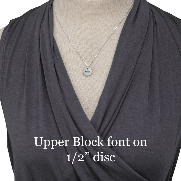 1/2" Thai Fine Silver Name Disc necklace, personalized with the name Kara hand stamped onto the charm, shown on model