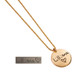 Custom gold disc handwriting necklace, personalized with daughter's handwritten signature "Lilliana (heart)", shown from the side on white