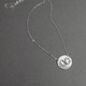 Silver monogram necklace, shown from side