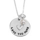 Close up of custom hand stamped mom necklace in fine pewter, shown with pearl, personalized with the message, "Love You More"
