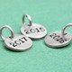 Hand stamped silver year charm for teachers and grads, side view