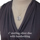 1" sterling silver disc with handwriting shown on a model