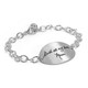 Silver oval handwriting bracelet, with actual handwriting, shown in full from side on white