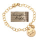 Custom memorial gold charm bracelet, engraved with note in father's handwriting & his signature, with gold puffed heart by the charm, shown on white with original handwriting used to personalize the bracelet