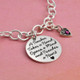 Side view of custom teacher thank you gift - silver charm bracelet personalized with saying & silver heart birthstone charm