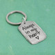 Military tag handwritten pewter keychain, shown from the side