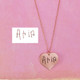 Handwriting heart necklace in rose gold, engraved with daughter Aria's signature, shown with original handwritten handwriting used to personalize it.