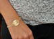 Model wearing  Custom Gold Oval Handwriting Bracelet, personalize with husband's actual handwriting