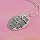Side view of I love you a bushel and a peck fine silver necklace with hand stamped message